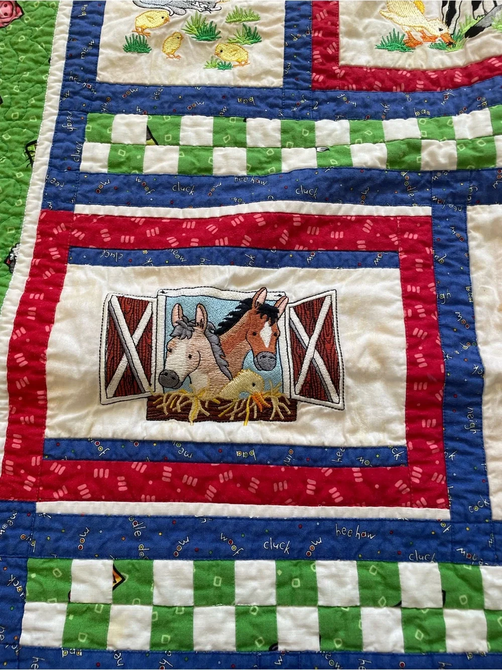 Quack, Moo, Oink quilt with farm animals and 'Quack, Moo, Oink'